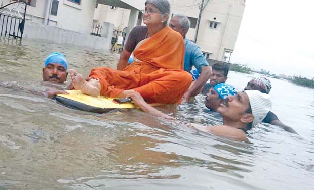 Additional director-general of police, (ADGP), Coastal Security Group CID, C. Sylendra Babu, (on right in picture), along with a team of police personnel rescued nearly 45 people stranded in CTO Colony at Tambaram on Monday. Since the Additional director-general of police, (ADGP), Coastal Security Group CID, C. Sylendra Babu, (on right in picture), along with a team of police personnel rescued nearly 45 people stranded in CTO Colony at Tambaram on Monday. Since the